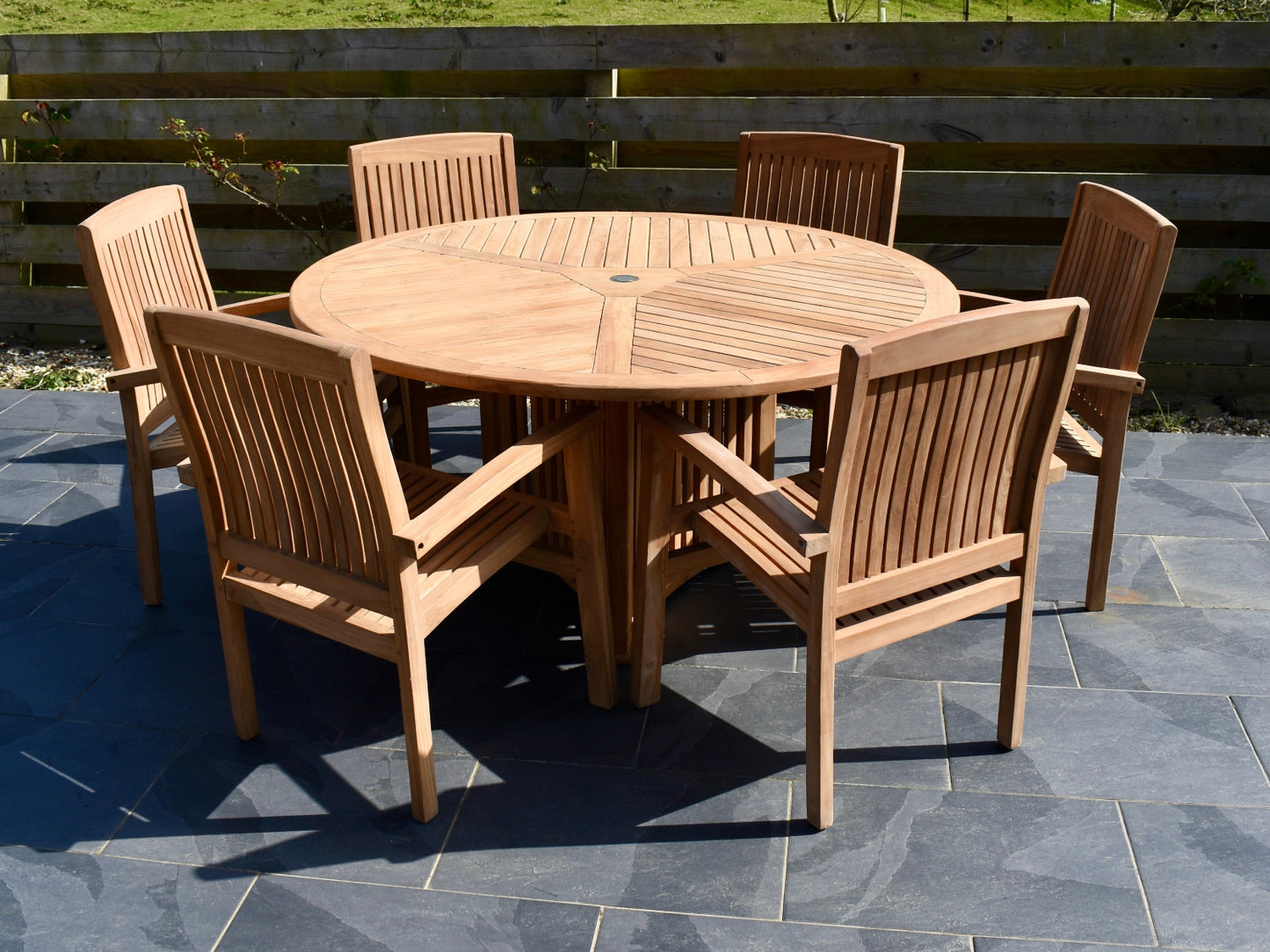 stunning teak garden dining table set with our unique radar design dining table and 6 henley stacking armchairs
