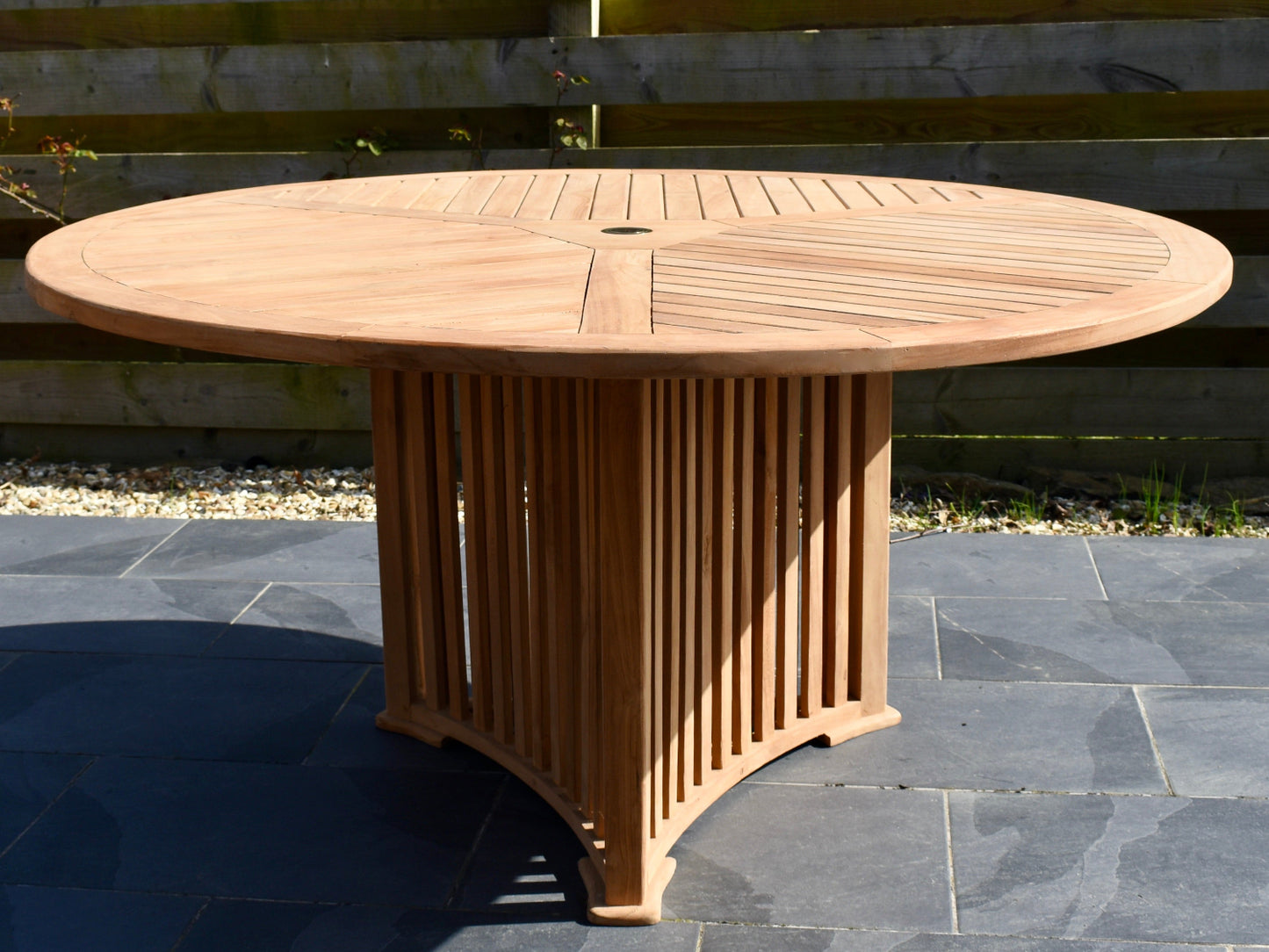 table top and pedestal base detail of our unique radar style 6 seater teak garden dining table