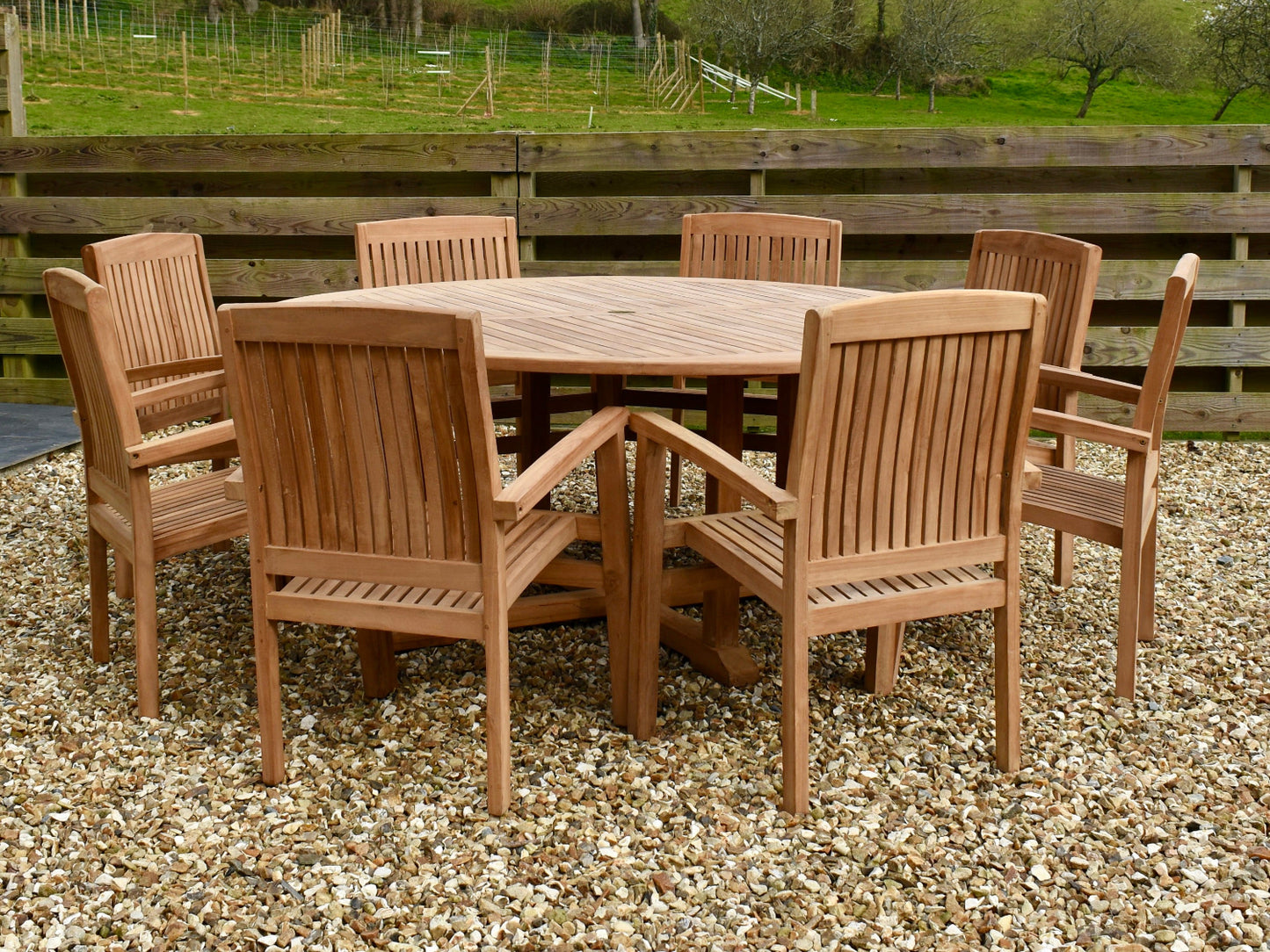 Traditional teak 180cm round garden dining set with 8 stacking garden armchairs