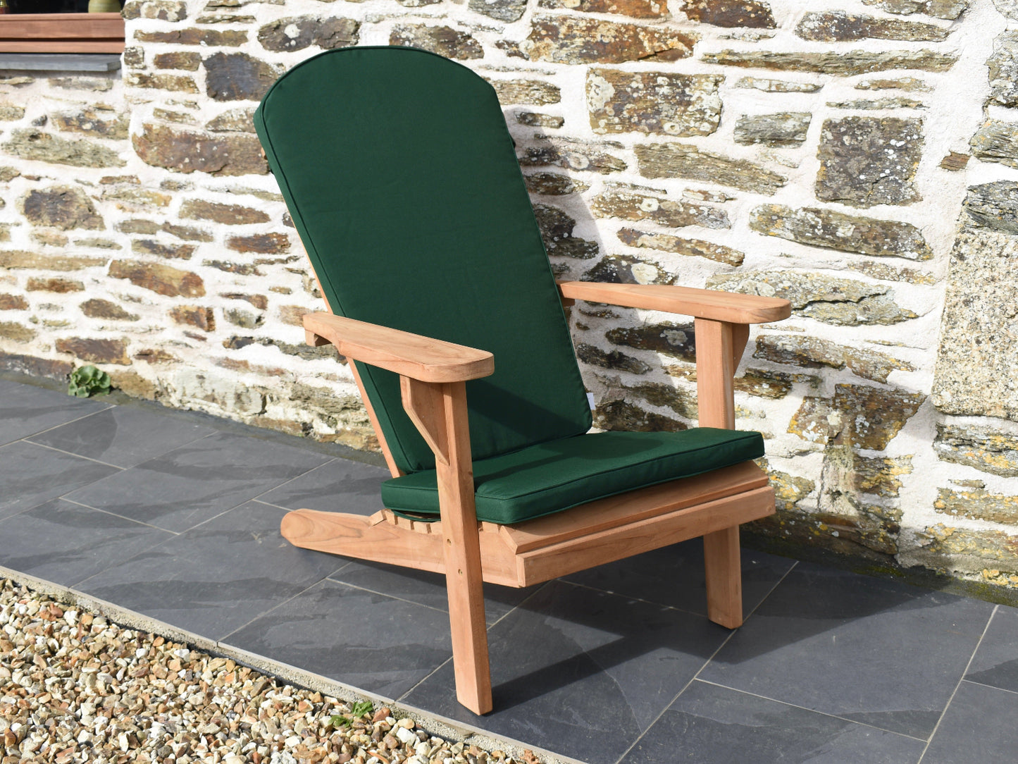 dark forest green outdoor seat cushion for a classic Adirondack style garden easy chair
