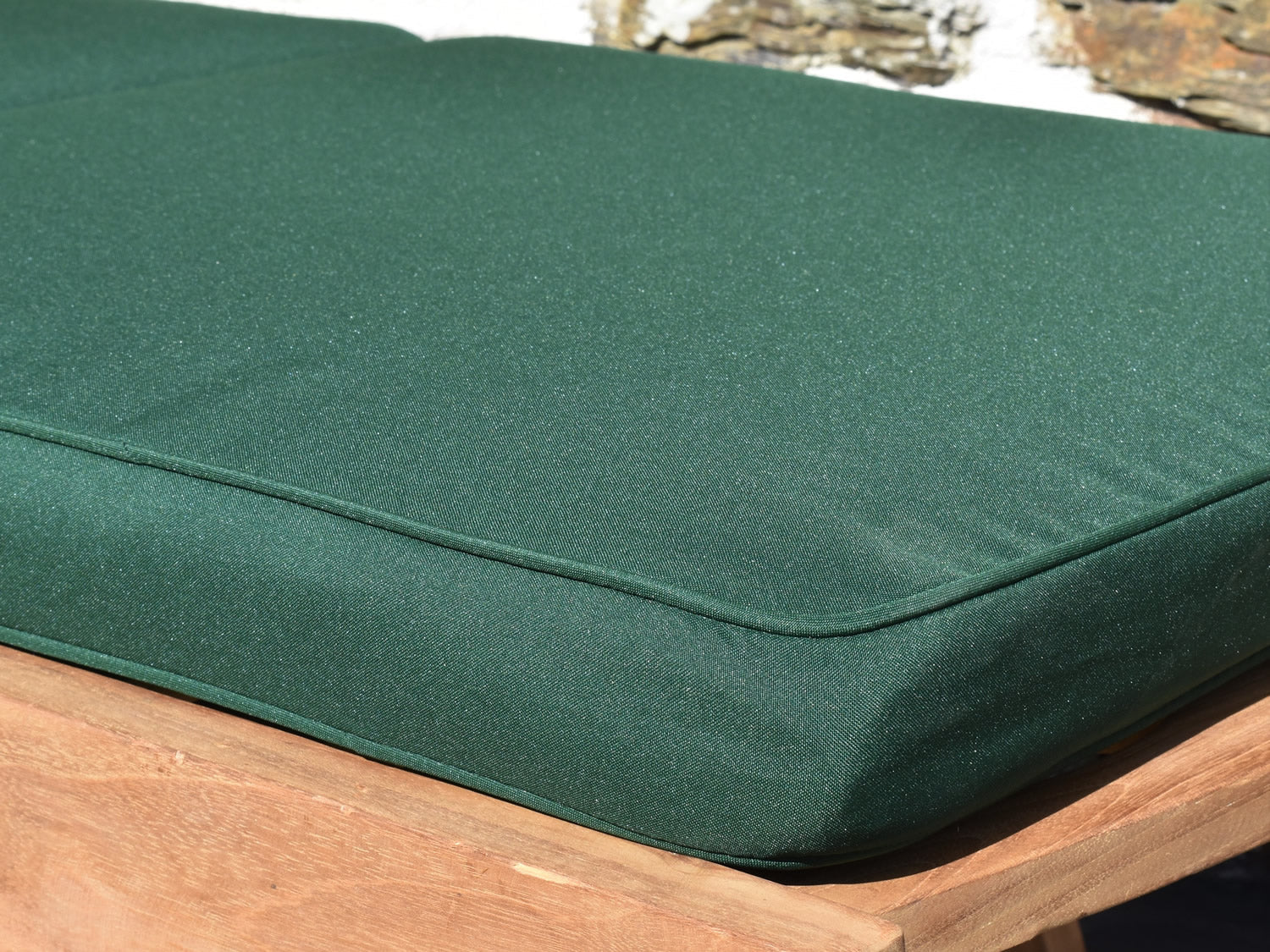 close-up detail of classic dark green garden sun lounger cushion fabric