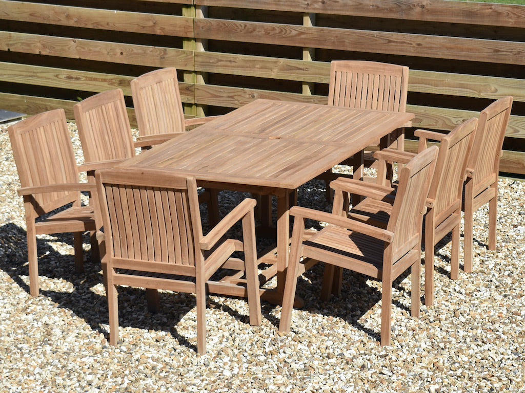 rectangular teak garden table with 8 stacking garden armchairs