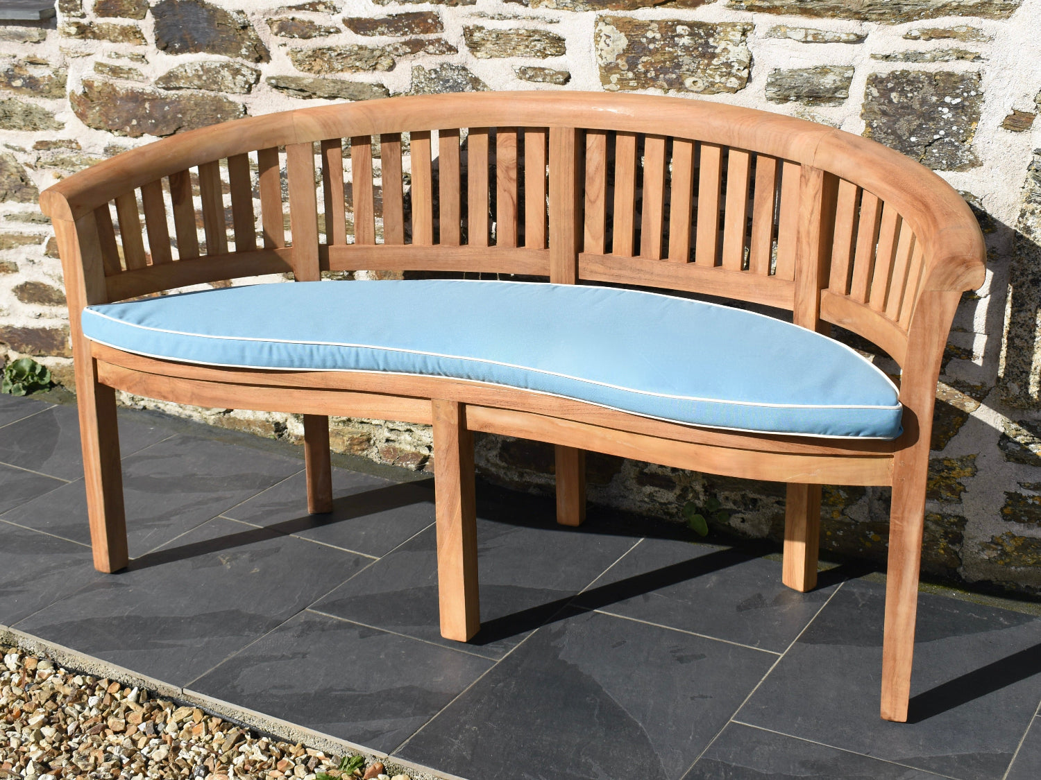 Luxury light blue curved banana bench outdoor cushion with contrast white piping and machine washable cover