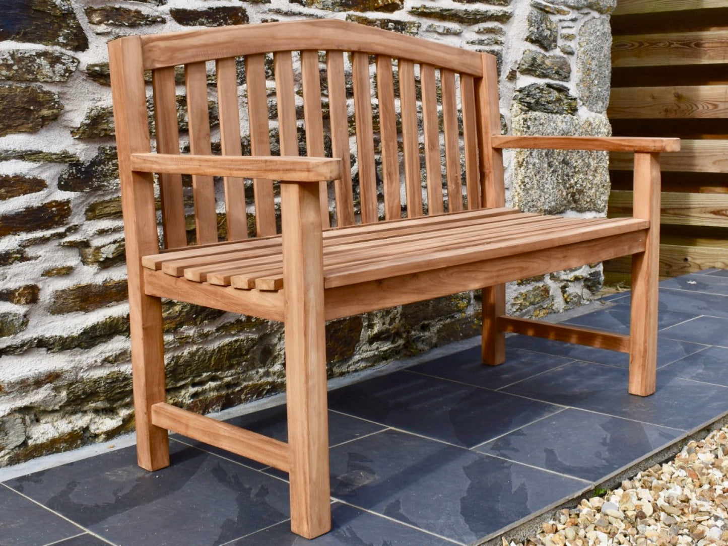 2 seater solid teak garden bench with a curved back rail 