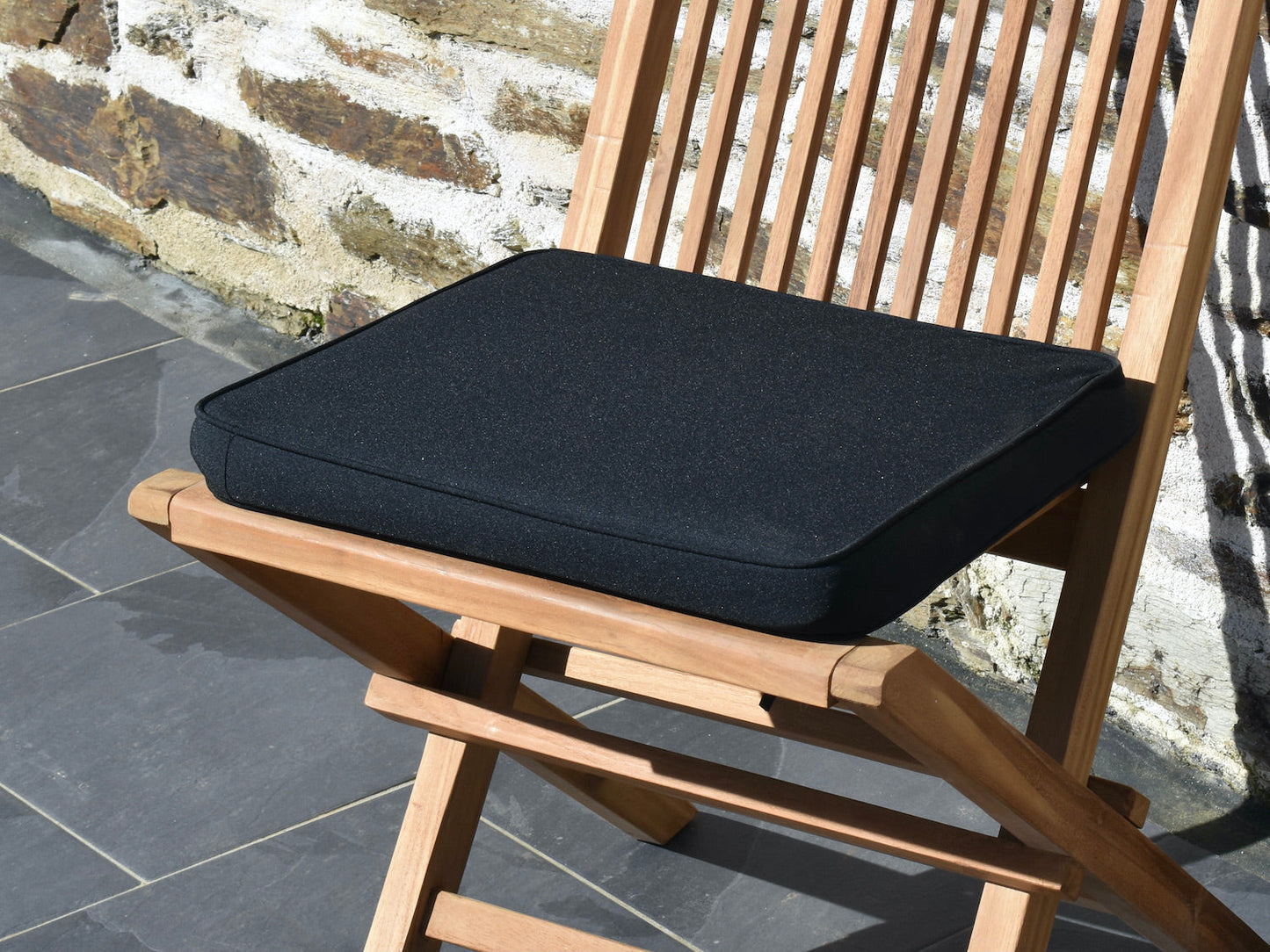 close-up polyester fabric detail of classic black small garden seat pad cushion