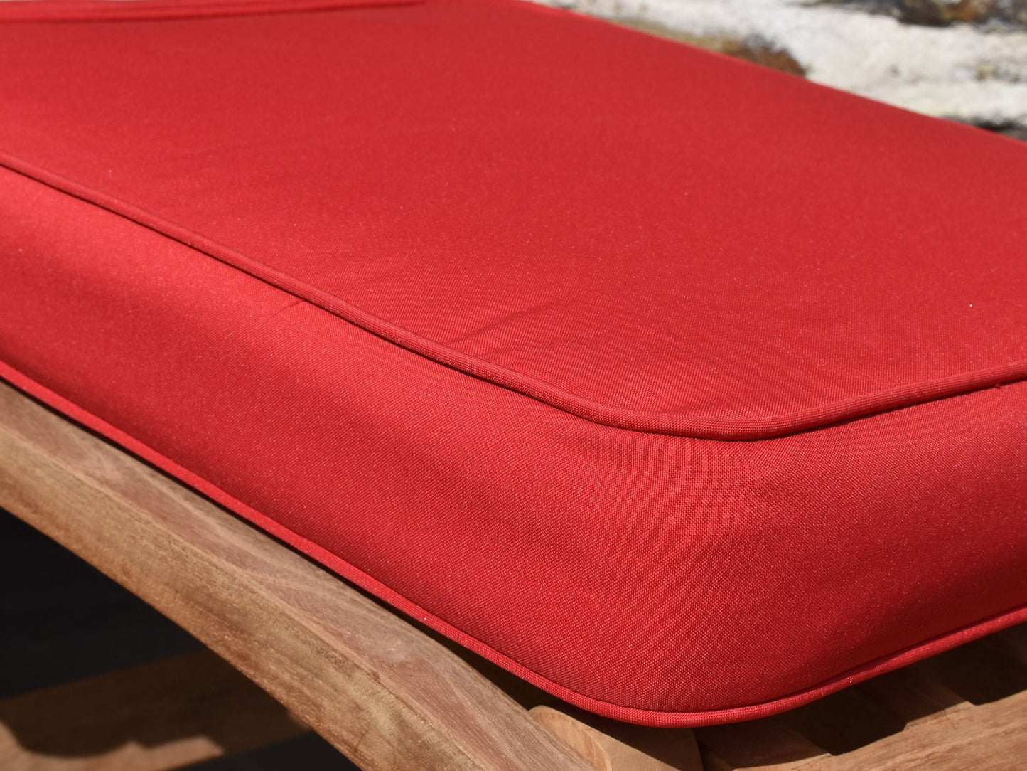 close up fabric detail of red garden steamer chair cushion