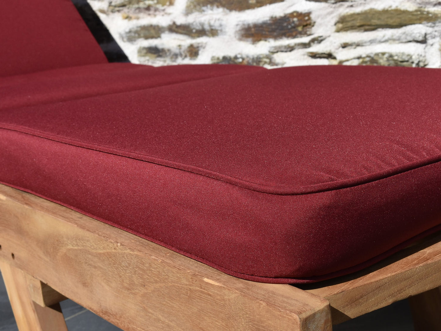 close-up detail of burgundy sun lounger cushion fabric