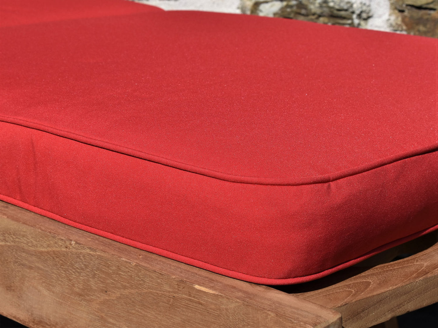 close-up detail red garden sunlounger cushion fabric