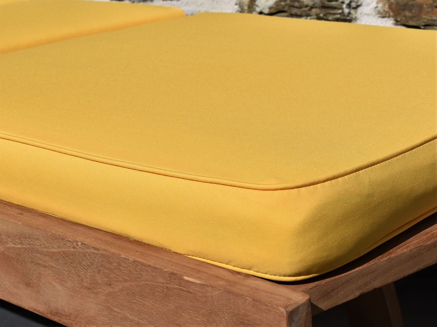 close-up fabric detail of yellow garden sunlounger cushion