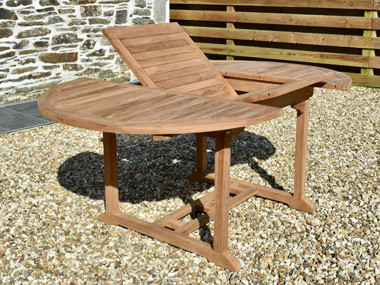 teak circular extending garden dining table with fold-away extension leaf