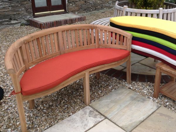 Classic terracotta orange cushion for curved banana garden bench 