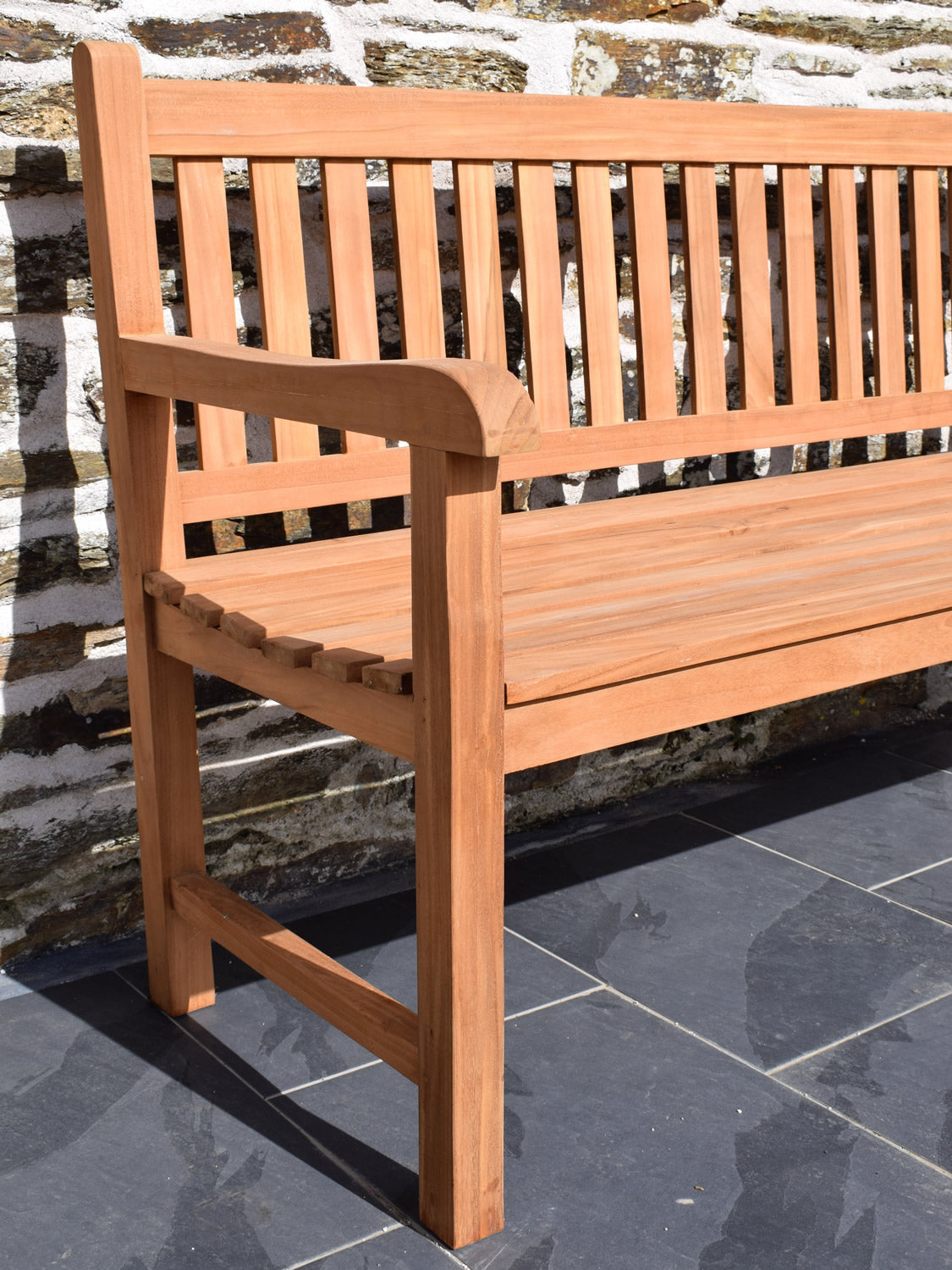 solid teak wooden garden bench close up detail