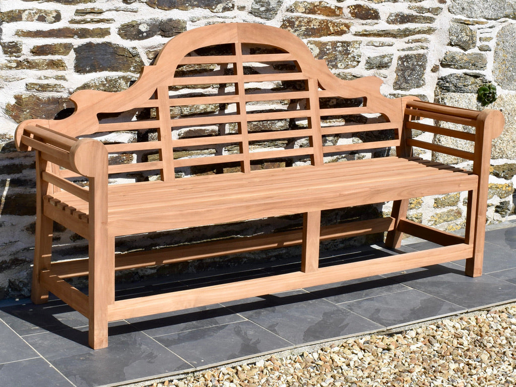 ornate teak garden bench with lattice back and scroll arm design