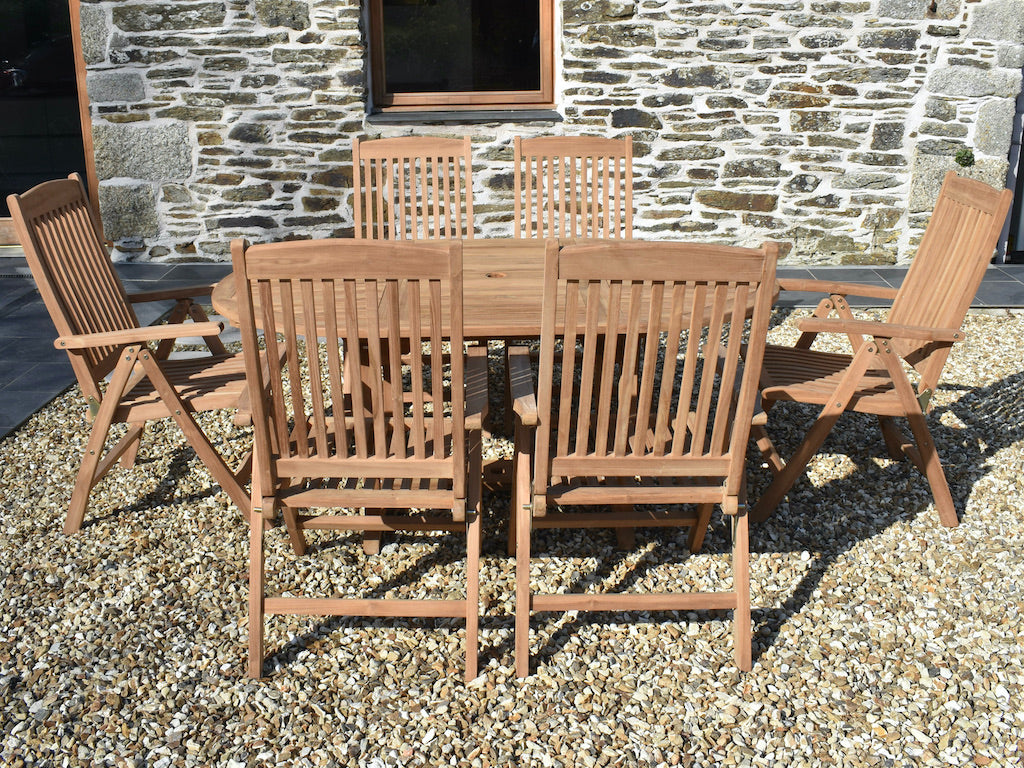 teak garden dining set with 120cm extending garden table and six reclining garden armchairs - side view